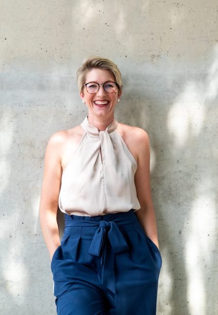 A woman smiling fully